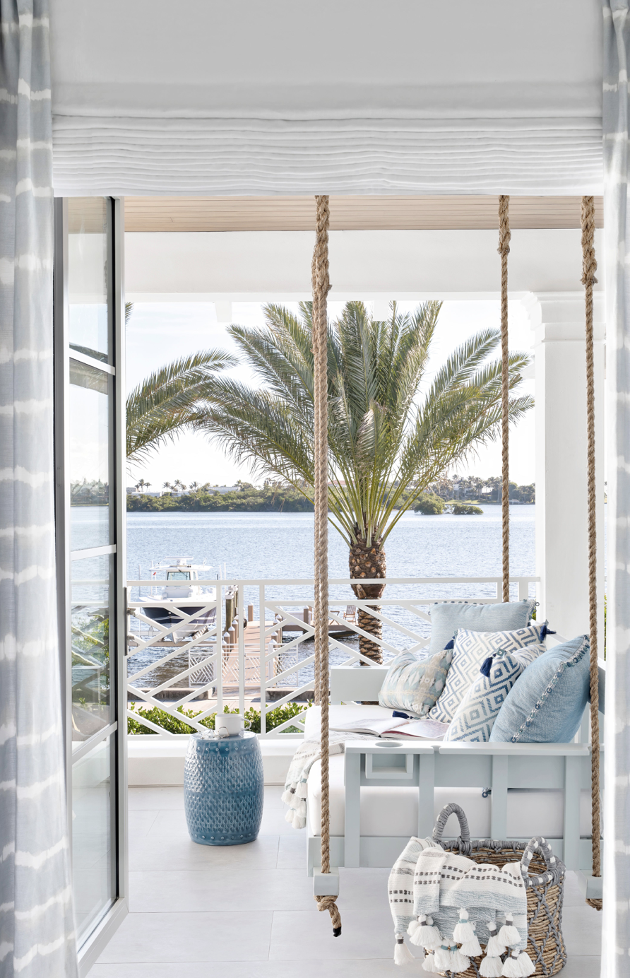 It’s easy to get into the swing of things on this porch overlooking the water. Find similar porch swings here.
